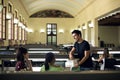 Group of happy students and friends studying in school library