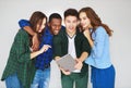 Group of happy students people friends with phones tablets gadgets laugh