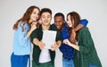 Group of happy students people friends with phones tablets gadgets laugh Royalty Free Stock Photo