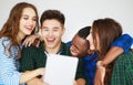 Group of happy students people friends with phones tablets gadgets laugh Royalty Free Stock Photo