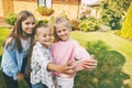 Group of happy teenage girls laughing and taking a selfie on a mobile phone outdoors. Royalty Free Stock Photo