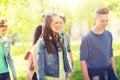 Group of happy teenage students walking outdoors Royalty Free Stock Photo