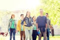 Group of happy teenage students walking outdoors Royalty Free Stock Photo