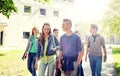 Group of happy teenage students walking outdoors Royalty Free Stock Photo