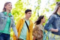 Group of happy teenage students walking outdoors Royalty Free Stock Photo