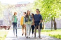 Group of happy teenage students walking outdoors Royalty Free Stock Photo