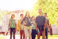 Group of happy teenage students walking outdoors Royalty Free Stock Photo