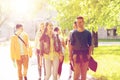 Group of happy teenage students walking outdoors Royalty Free Stock Photo