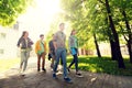 Group of happy teenage students walking outdoors Royalty Free Stock Photo