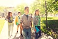 Group of happy teenage students walking outdoors Royalty Free Stock Photo