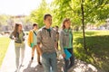 Group of happy teenage students walking outdoors Royalty Free Stock Photo