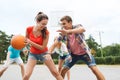 Group of happy teenagers playing basketball Royalty Free Stock Photo