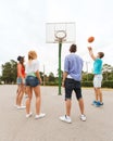 Group of happy teenagers playing basketball Royalty Free Stock Photo