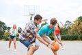 Group of happy teenagers playing basketball Royalty Free Stock Photo