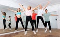 Happy teens jumping in choreography class Royalty Free Stock Photo