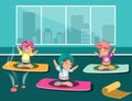 Group of happy women doing yoga in a studio