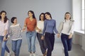 Group of happy women walking hand in hand, showing mutual support and solidarity Royalty Free Stock Photo