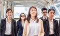 Group of happy young business team, businesspeople walking the outdoor office together success teamwork for concepts Royalty Free Stock Photo