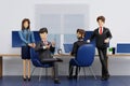 Group of happy young businessmen and businesswoman relaxing meeting talking working in office, 3D rendering Royalty Free Stock Photo