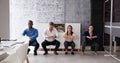 Group Of Happy Young Businesspeople Doing Stretching Exercise