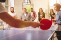 Group of happy young friends playing ping pong table tennis Royalty Free Stock Photo