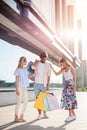 Group of happy young friends returning from shopping Royalty Free Stock Photo