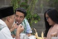 Group of happy young muslim having dinner outdoor during ramadan