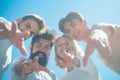 Group of happy young people in circle outdoors. Bearded male. Blue sky. Friendship day. Stylish people. Circle of Royalty Free Stock Photo