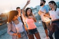 Group of happy young people friends dancing and having fun in party Royalty Free Stock Photo