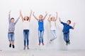 Group of happy young people jumping on white Royalty Free Stock Photo