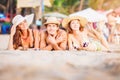 Group of happy young people lying on wite beach Royalty Free Stock Photo