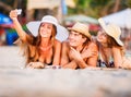 Group of happy young people lying on wite beach Royalty Free Stock Photo