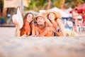 Group of happy young people lying on wite beach Royalty Free Stock Photo