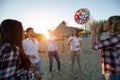 Group of happy young people playing with ball on beach Royalty Free Stock Photo