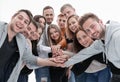 Group of happy young people showing their unity Royalty Free Stock Photo