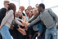 Group of happy young people showing their unity Royalty Free Stock Photo