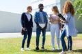 Group of happy young students speaking in a university. Royalty Free Stock Photo