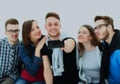 Group of happy young teenager students taking selfie photo isolated on white background. Royalty Free Stock Photo