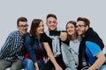 Group of happy young teenager students taking selfie photo isolated on white background. Royalty Free Stock Photo