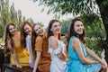Group of happy young women, female friends having fun on summer nature background. Many young female friends together Royalty Free Stock Photo