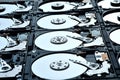 Group of hard disk drives. Many Open Hard drives. Close-up of the inside of PC hard drives. Technology background. Selective focus Royalty Free Stock Photo