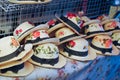 Group of hat for sale at bangnamphung floating market Thailand selective focus