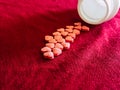 Group of hearts pills in red cloth background. Valentines day