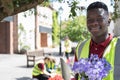 Group Of Helpful Teenagers Planting And Tidying Communal Flower