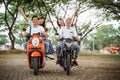 group of high school students celebrating graduation by motorbike Royalty Free Stock Photo
