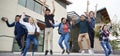 Group Of High School Students Jumping In Air Outside College Buildings Royalty Free Stock Photo