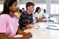 Group of high school students listening teacher during lecture in classroom Royalty Free Stock Photo