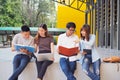 A group of high school students sit together to study in the area of the university Royalty Free Stock Photo