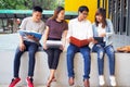 A group of high school students sit together to study in the area of the university Royalty Free Stock Photo