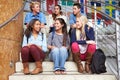 Group Of High School Students Sitting Outside Building Royalty Free Stock Photo